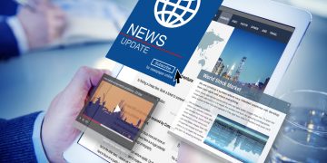 ipad with news and sponsored content