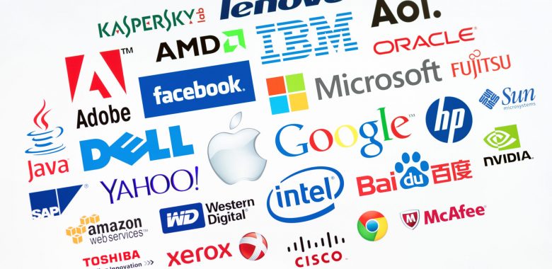 KIEV, UKRAINE - MAY 22, 2014: A logotype collection of well-known world top companies  of computer technologies on a monitor screen. Include Google, Apple, Microsoft, IBM, Adobe, Intel and other logo.
